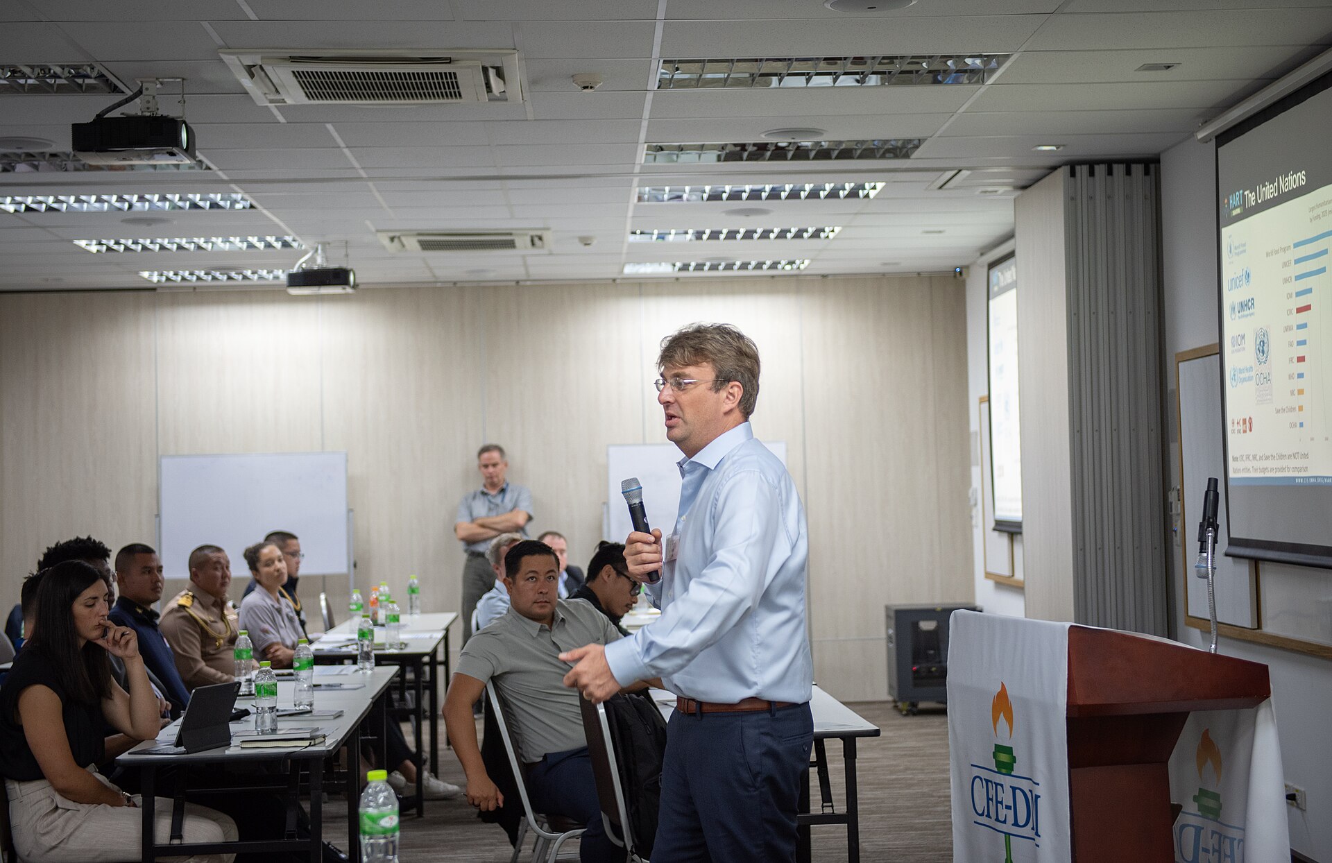 Senior Regional Emergency and Post Crisis Specialist Emergency and Post-Crisis Unit Regional Office for Asia and the Pacific for the United Nations International Organization for Migration, presents during a Humanitarian Assistance Response Training